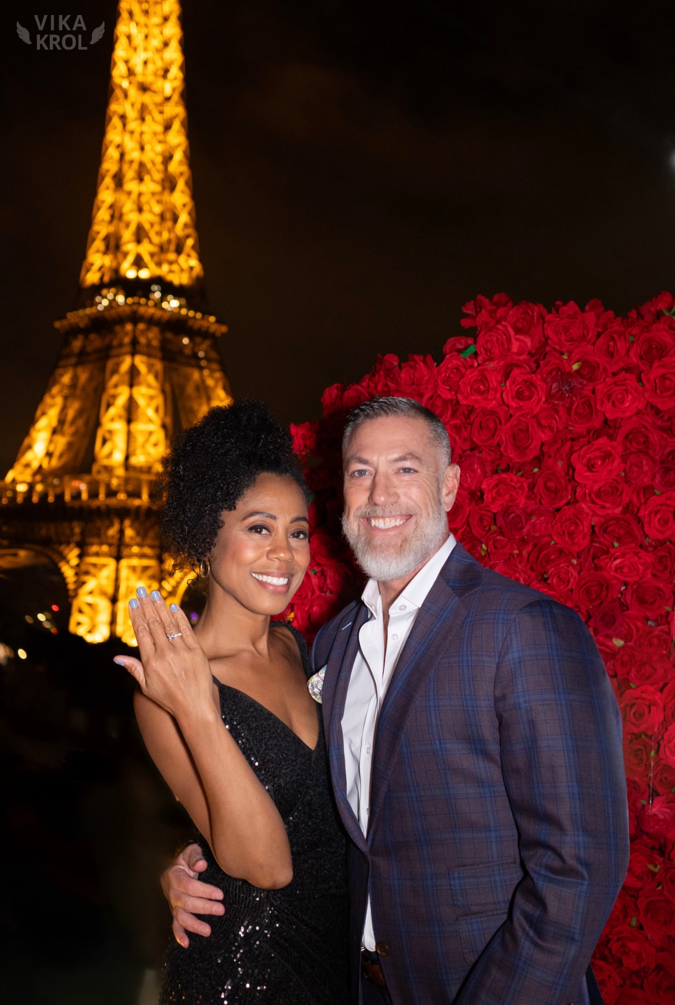 A split-screen photo. On the left, a chaotic, crowded Trocadéro at sunset. On the right, a serene, empty private rooftop with a couple in an intimate embrace, the Eiffel Tower sparkling behind them.